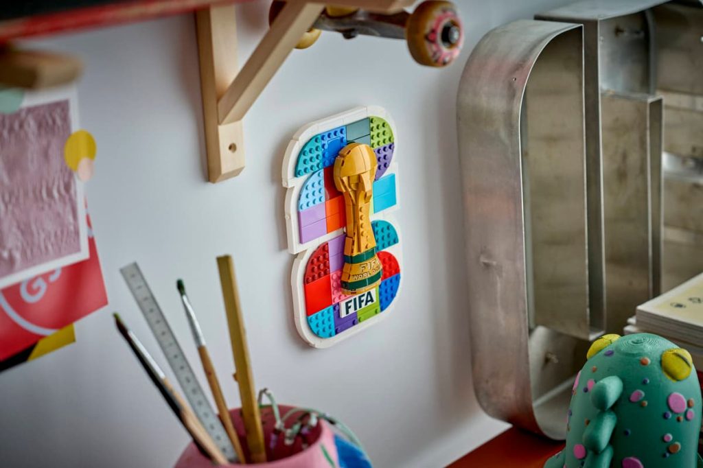 A wall with a picture of a trophy LEGO Editions