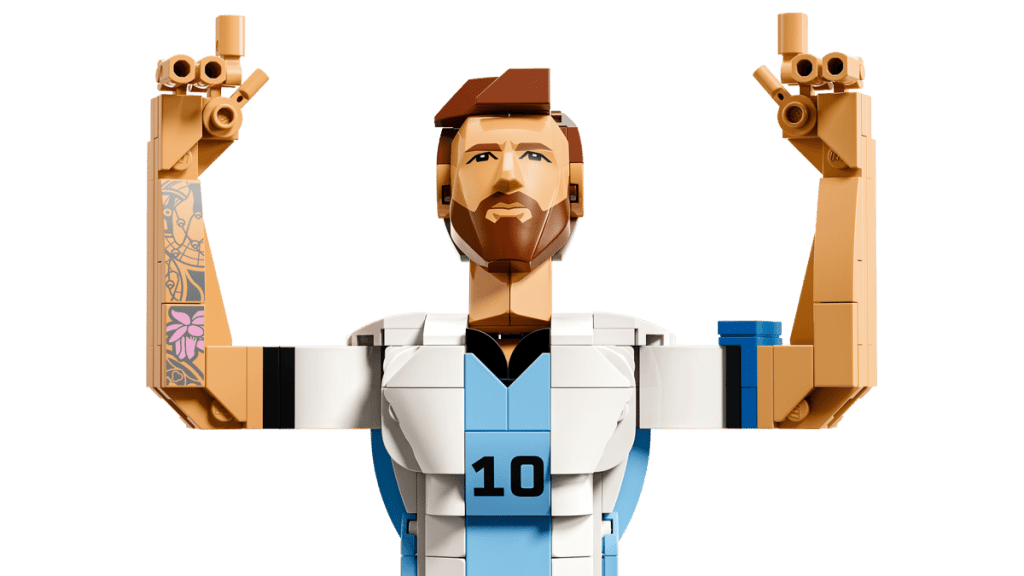 A toy figure of a man with his arms up LEGO Editions