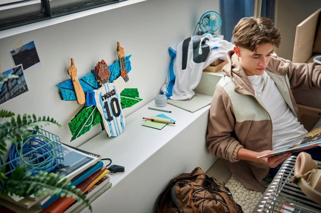A boy sitting at a desk LEGO Editions