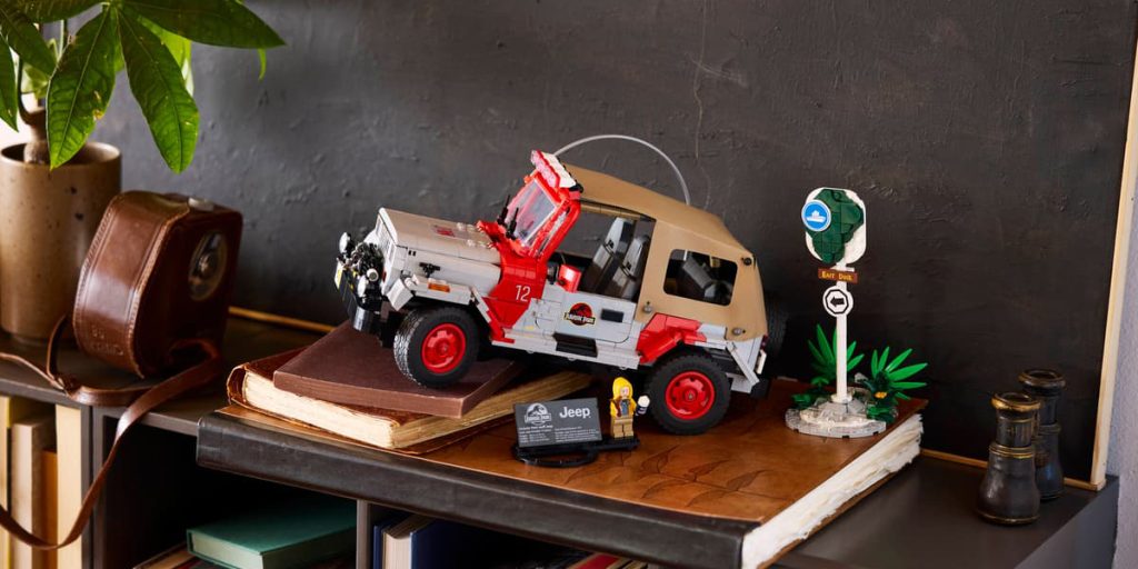 A toy car on a book shelf