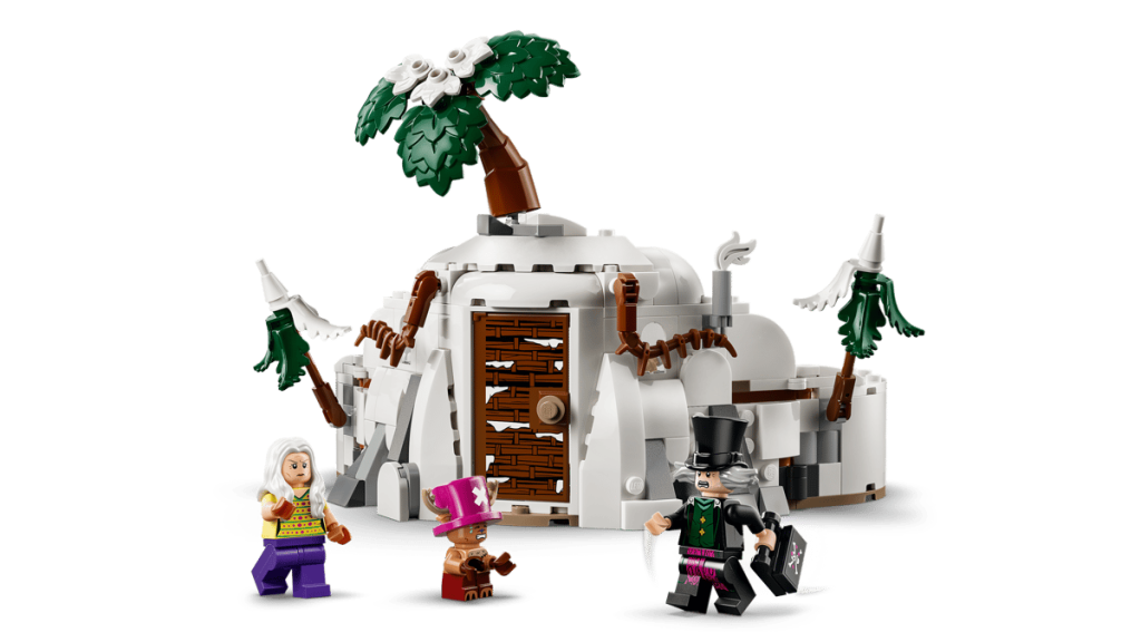 A group of lego figures next to a hut