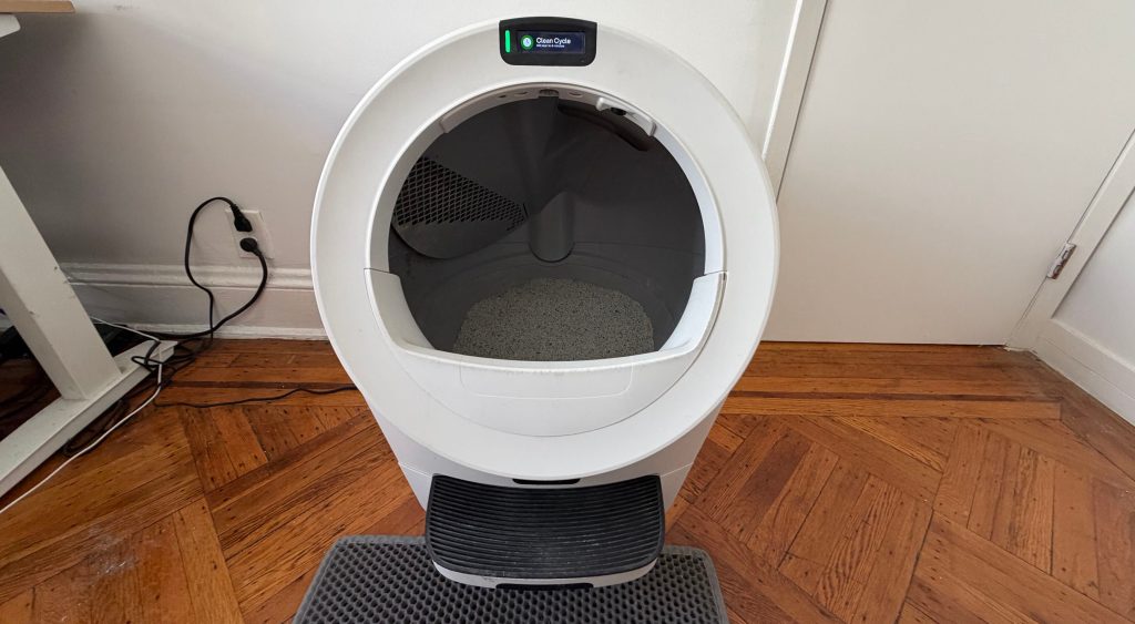 A white machine with a screen on it