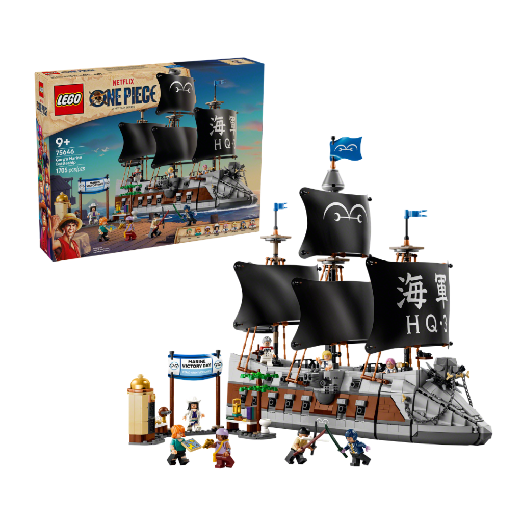 A toy ship with black sails and a box