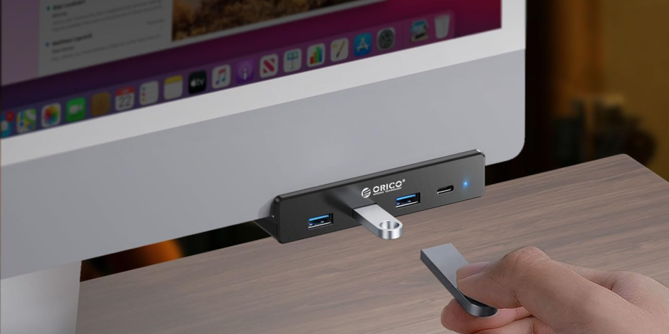 A hand holding a usb port