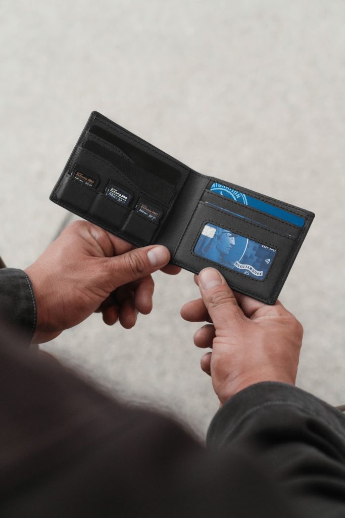A person holding a wallet