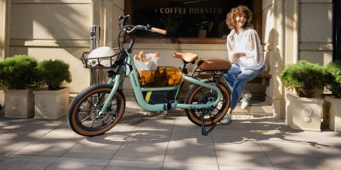 A woman sitting on a bicycle