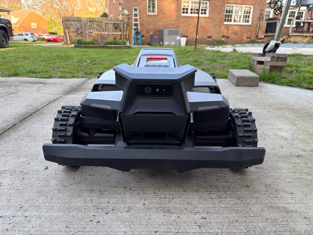 A black lawnmower on concrete