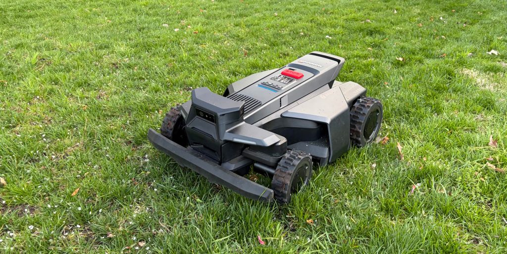 A black lawnmower on grass