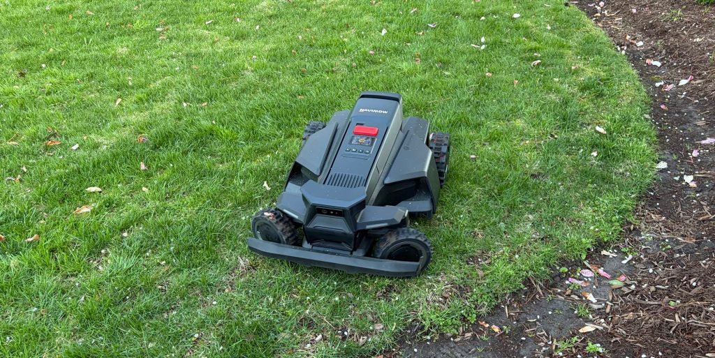 A black lawnmower on grass