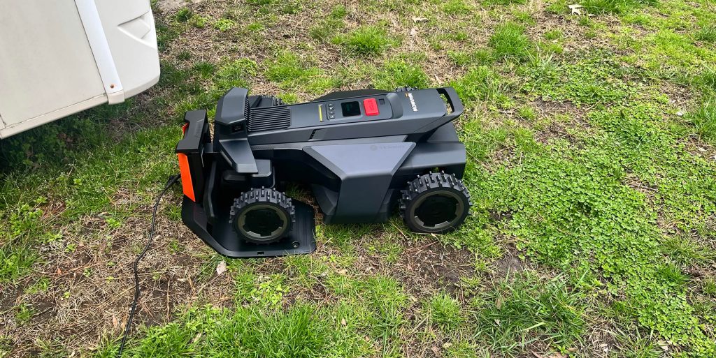 A black toy tractor on grass