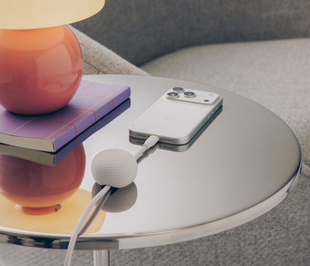 A phone and a book on a table