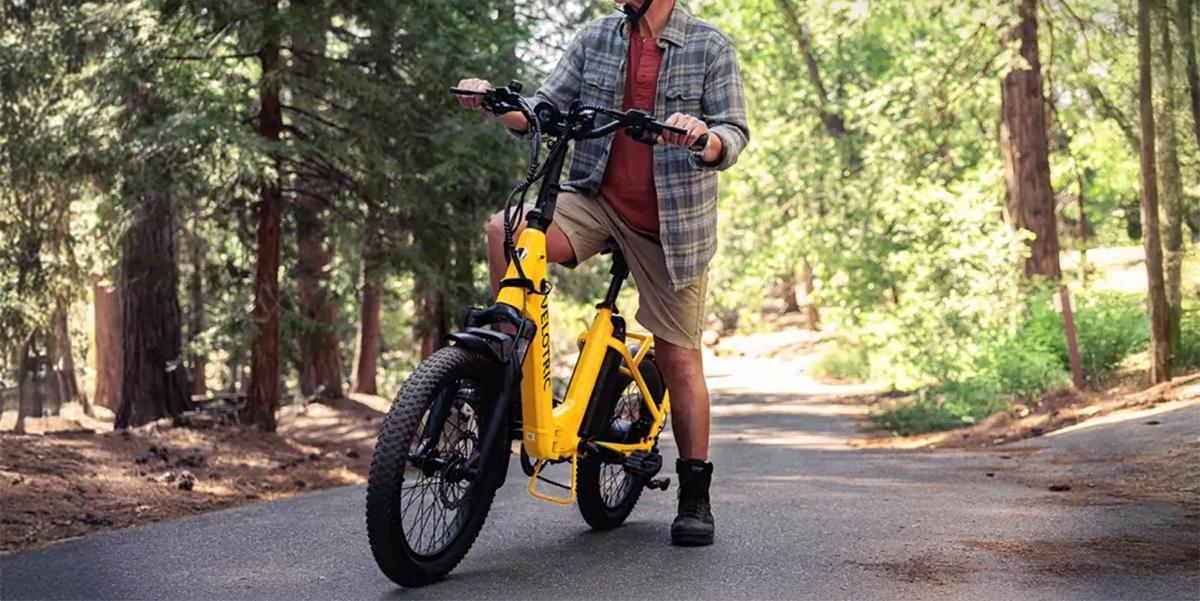 A man on a yellow bike