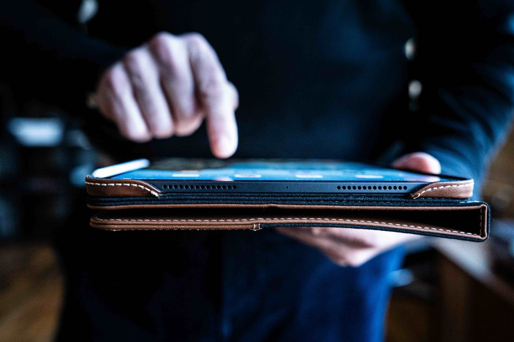 A person holding a tablet