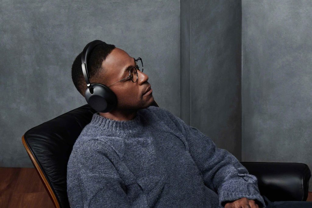 A man wearing headphones sitting in a chair