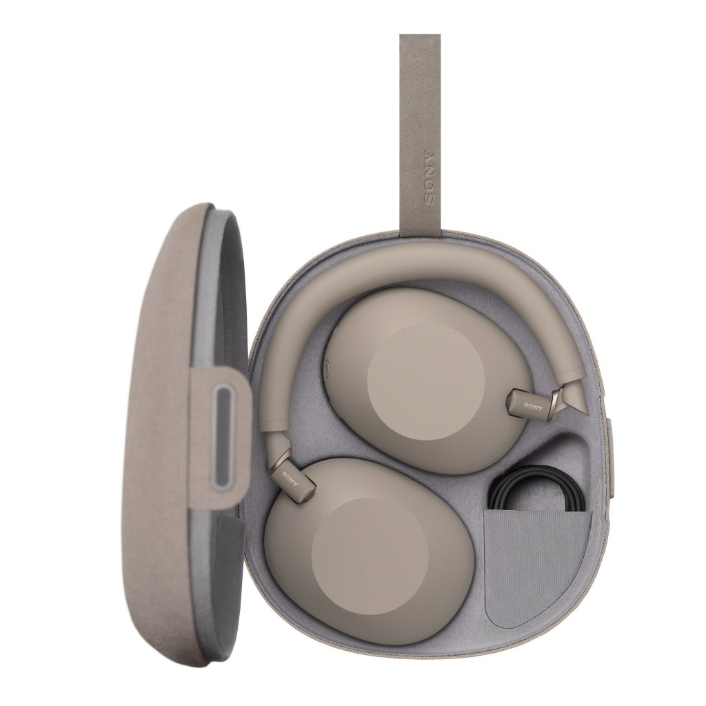 A pair of grey headphones in a case