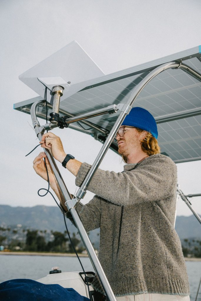 A man fixing a solar panel