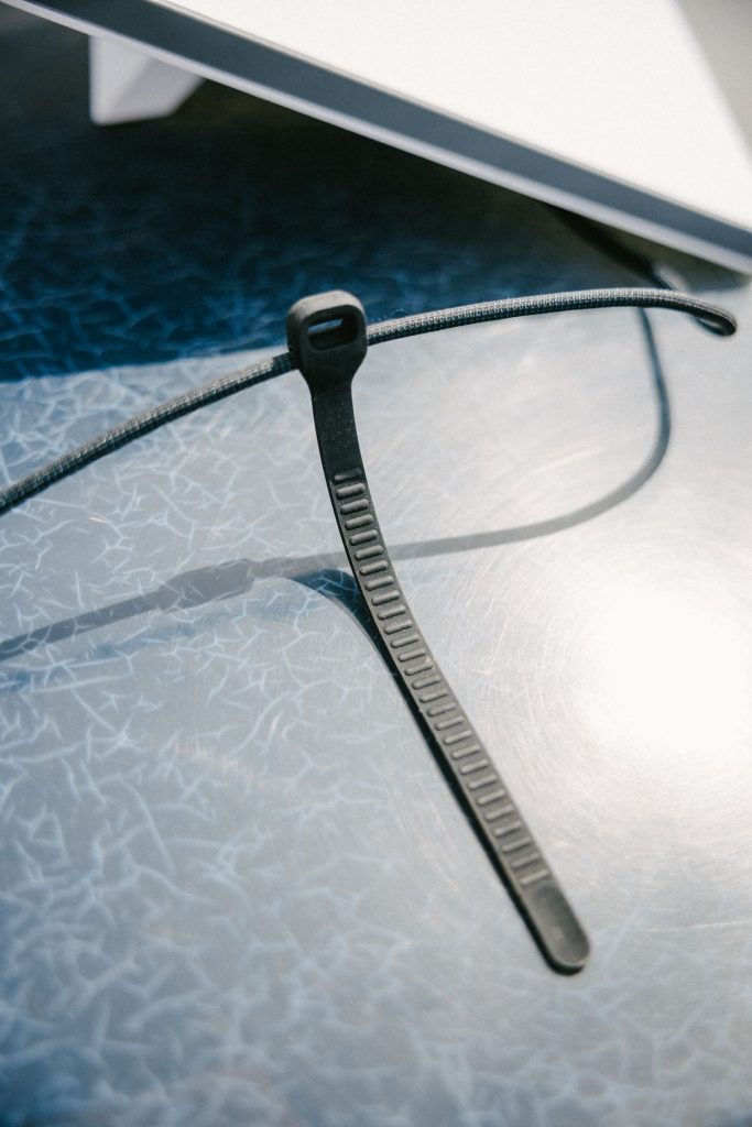 A black zip tie on a table