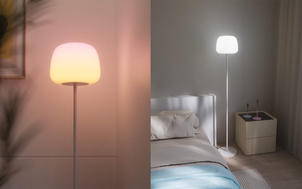 A lamp next to a bed
