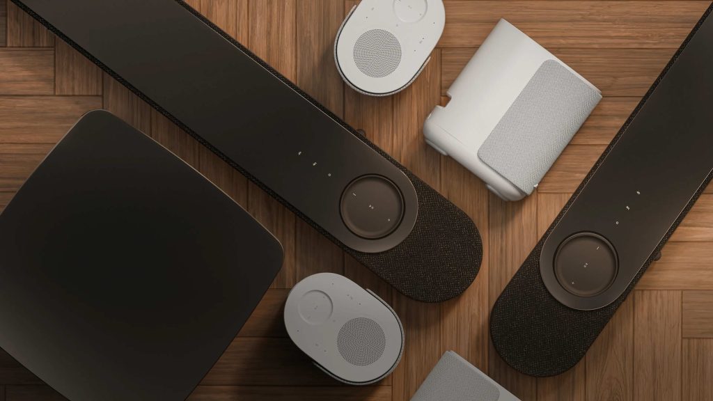 A group of electronic devices on a wood surface
