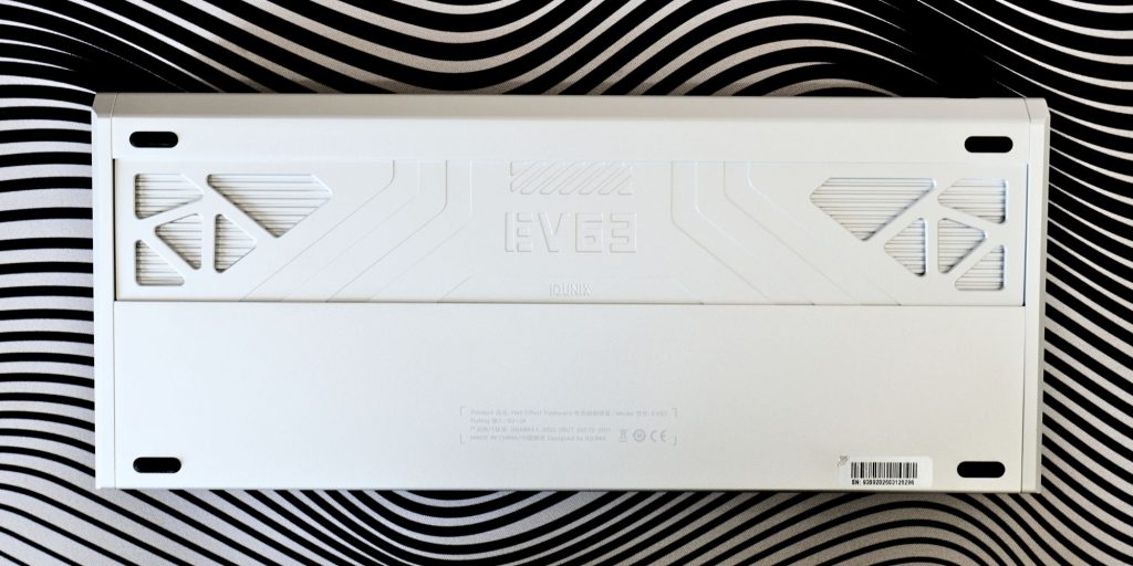 A white rectangular object on a striped surface