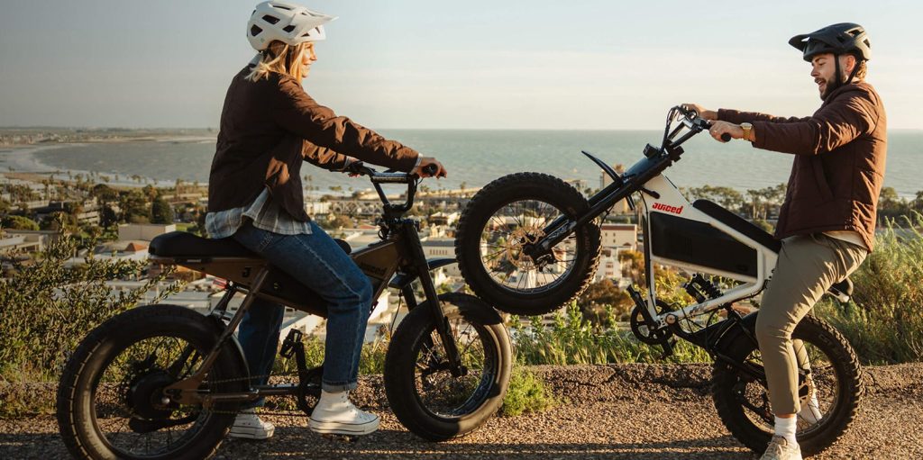 A woman on a bike with two wheels
