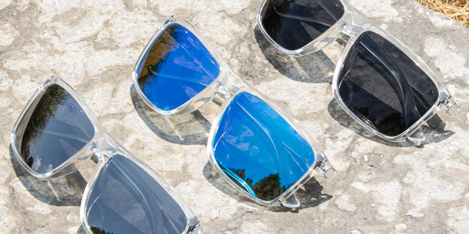 A group of sunglasses on a rock