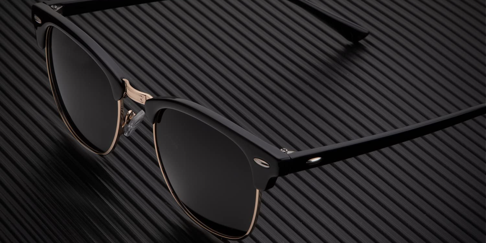 A pair of sunglasses on a black surface