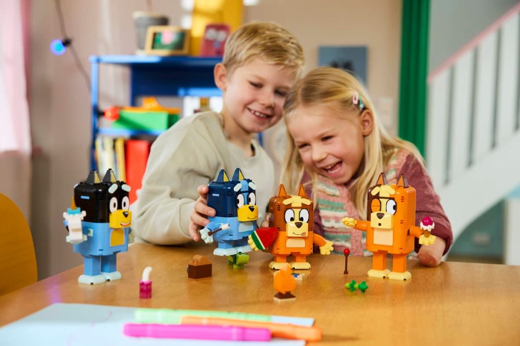 A boy and girl playing with toys