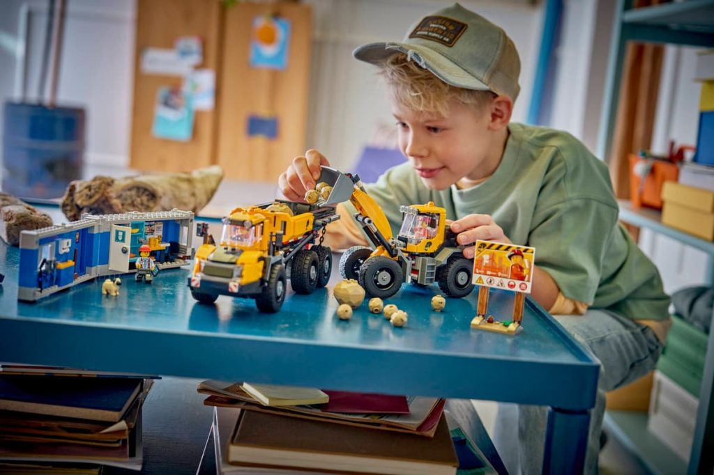 A boy playing with toys