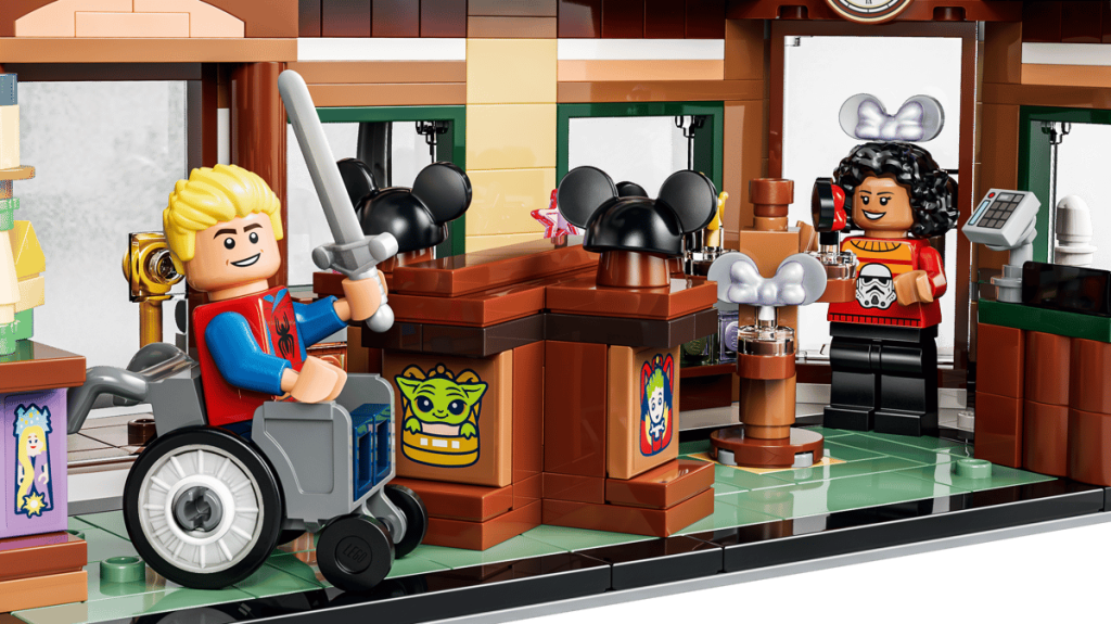 A toy building with a person in a wheelchair