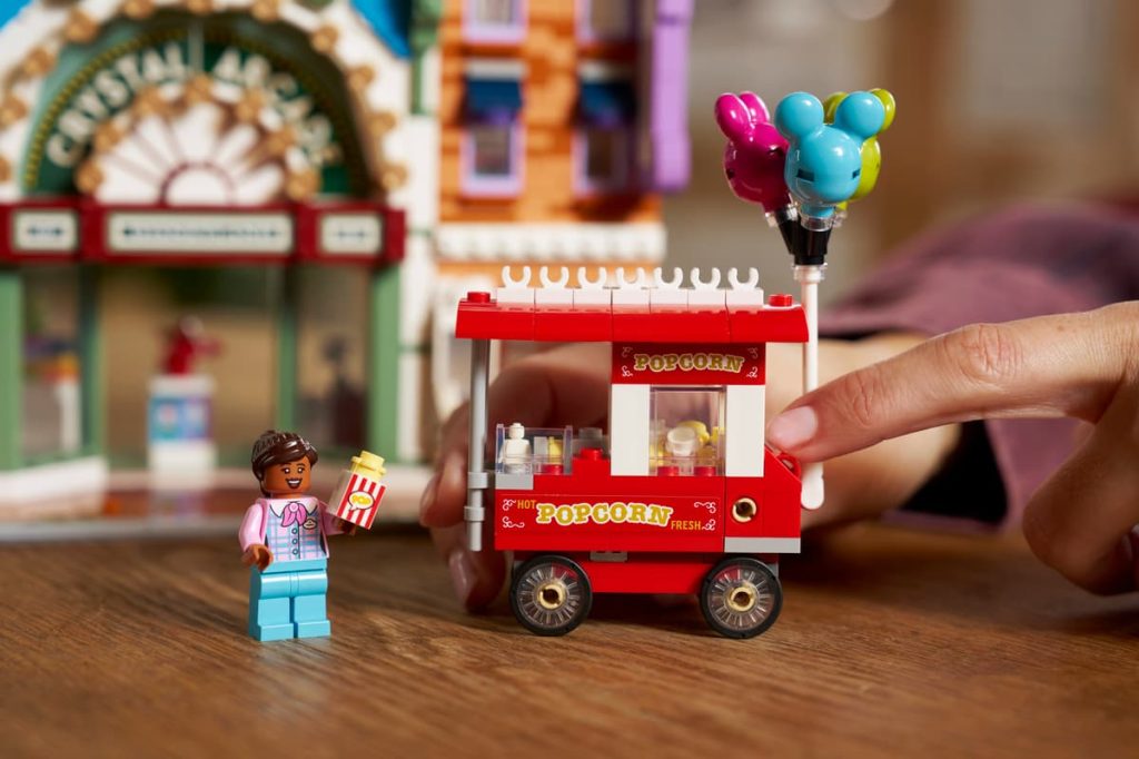 A hand holding a toy car