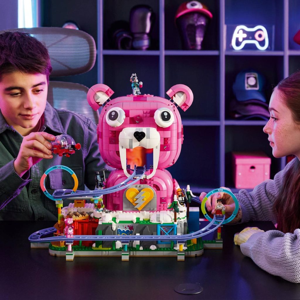 A boy and girl playing with a toy animal