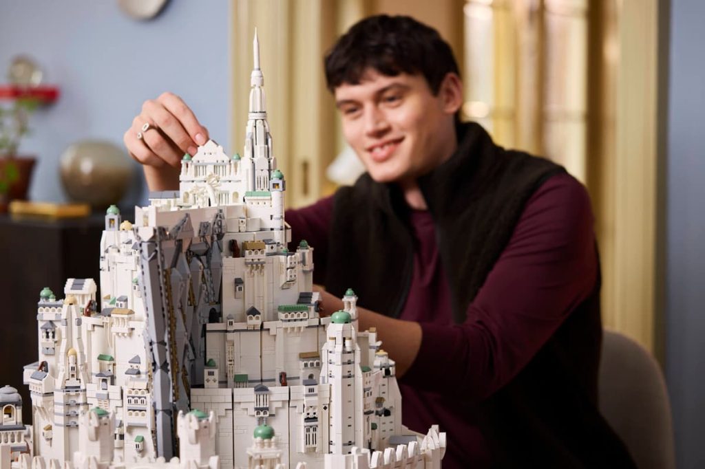 A man holding a building model