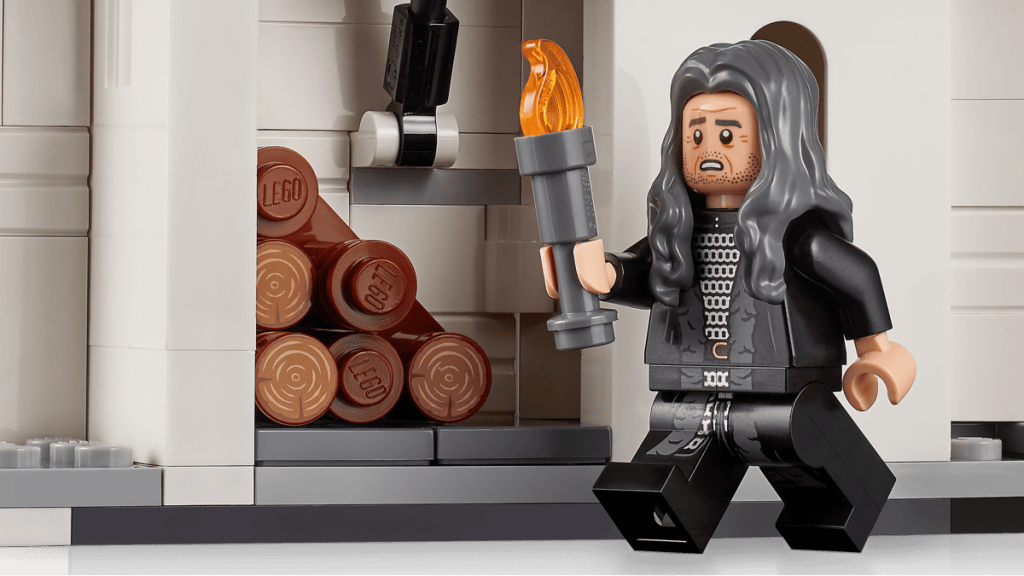A toy figurine of a man holding a torch