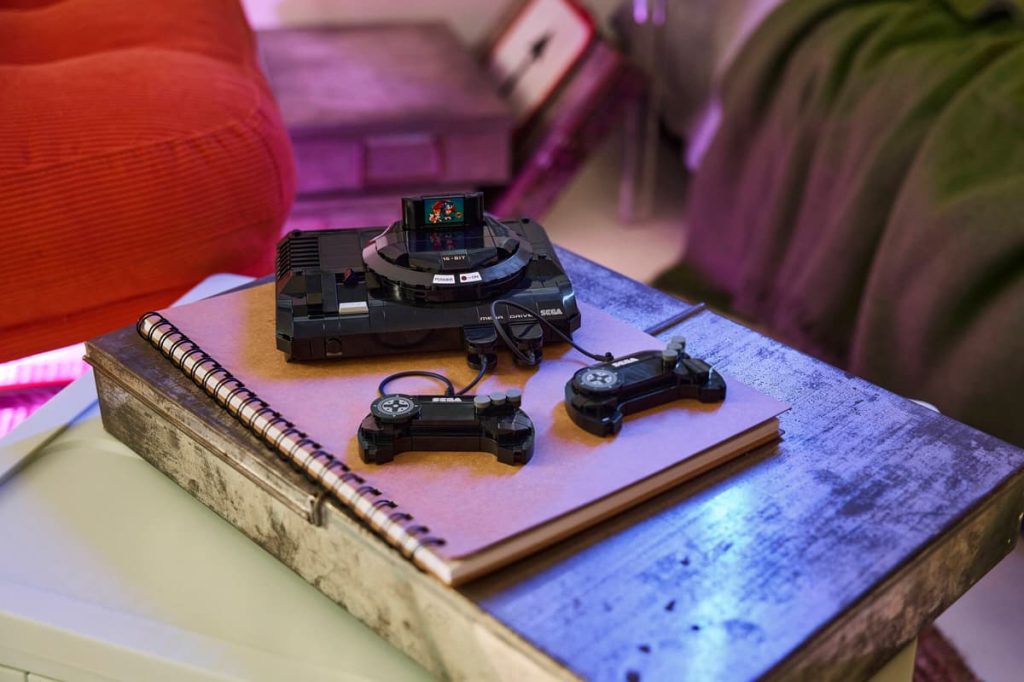 A video game console and controllers on a notebook