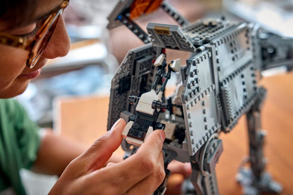 A person playing with a lego