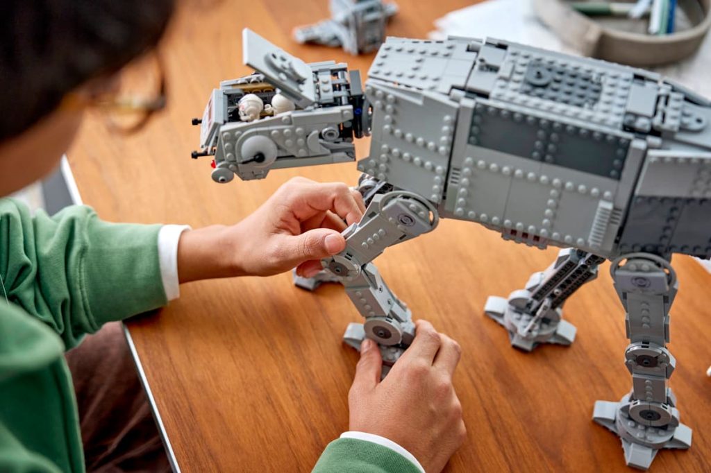 A person holding a toy robot