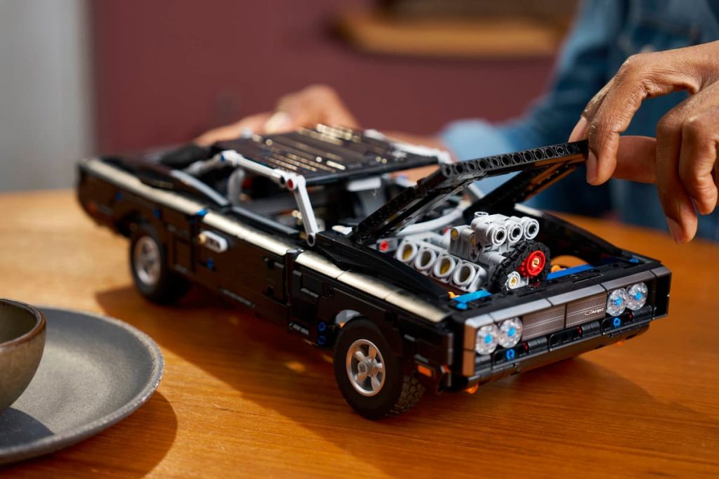 A person holding a toy car