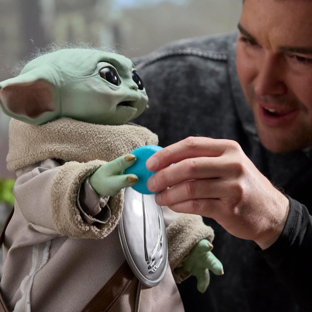 A man holding a toy