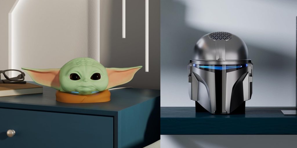 A toy head on a table next to a robot
