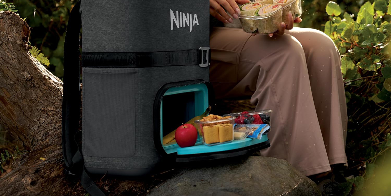 A person holding food in their containers