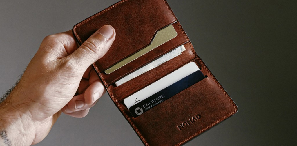 A hand holding a wallet