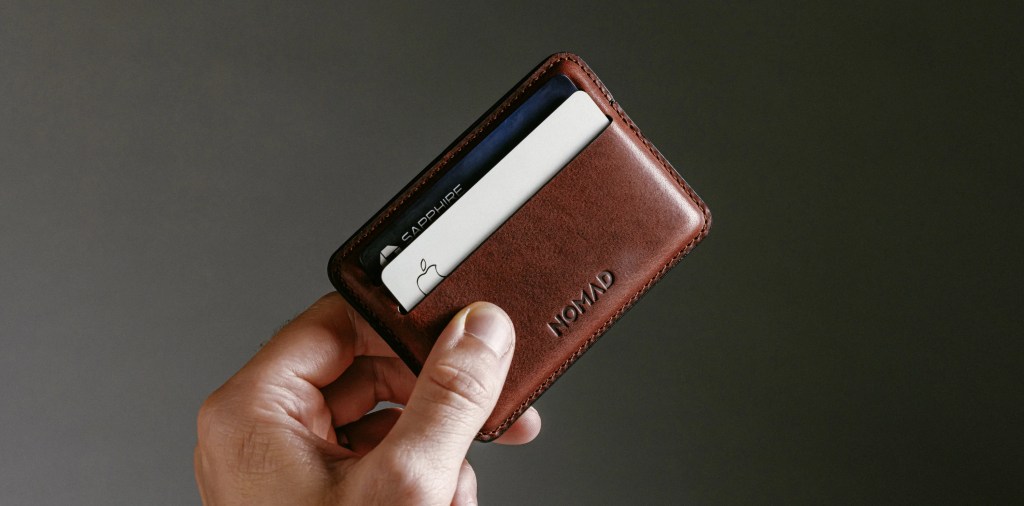 A hand holding a wallet