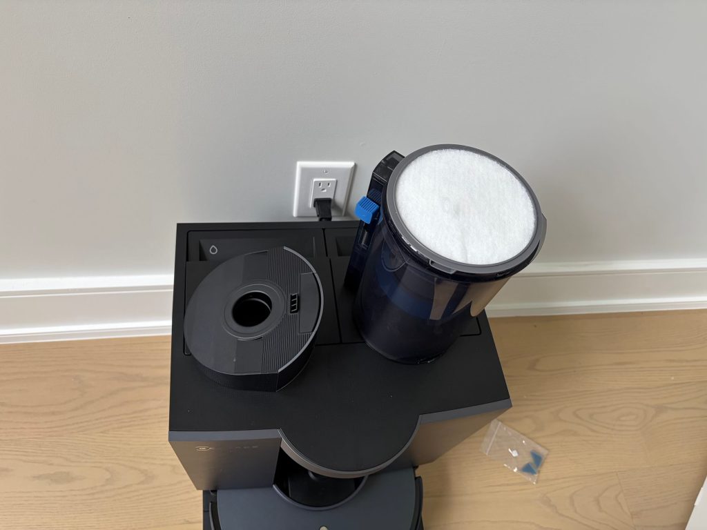 A vacuum cleaner on a wood floor