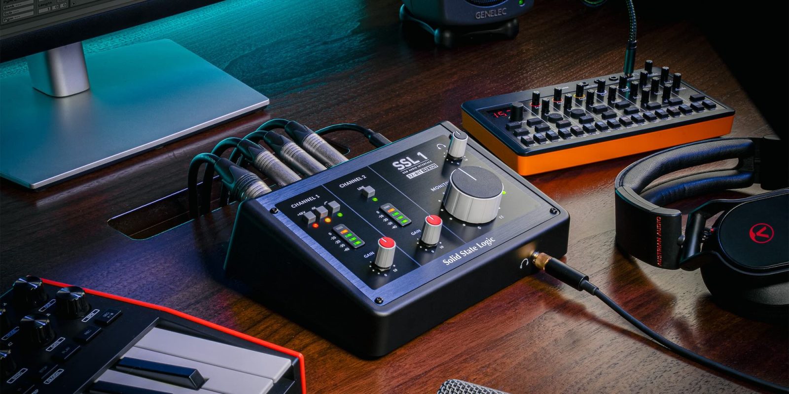 A black box with knobs and wires on a wooden surface