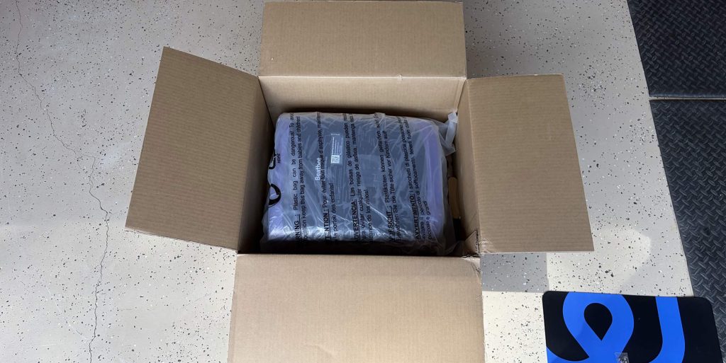 A box with a plastic bag inside