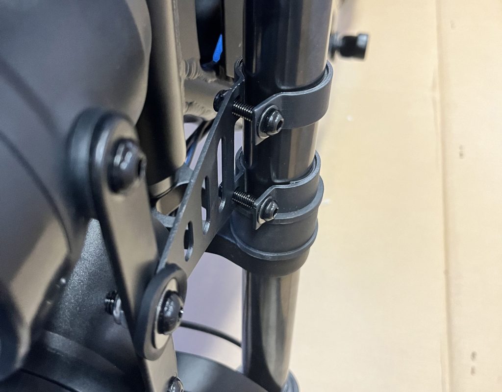 A black metal pipe with screws