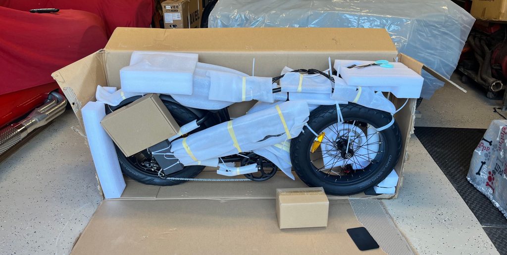 A motorcycle wrapped in plastic