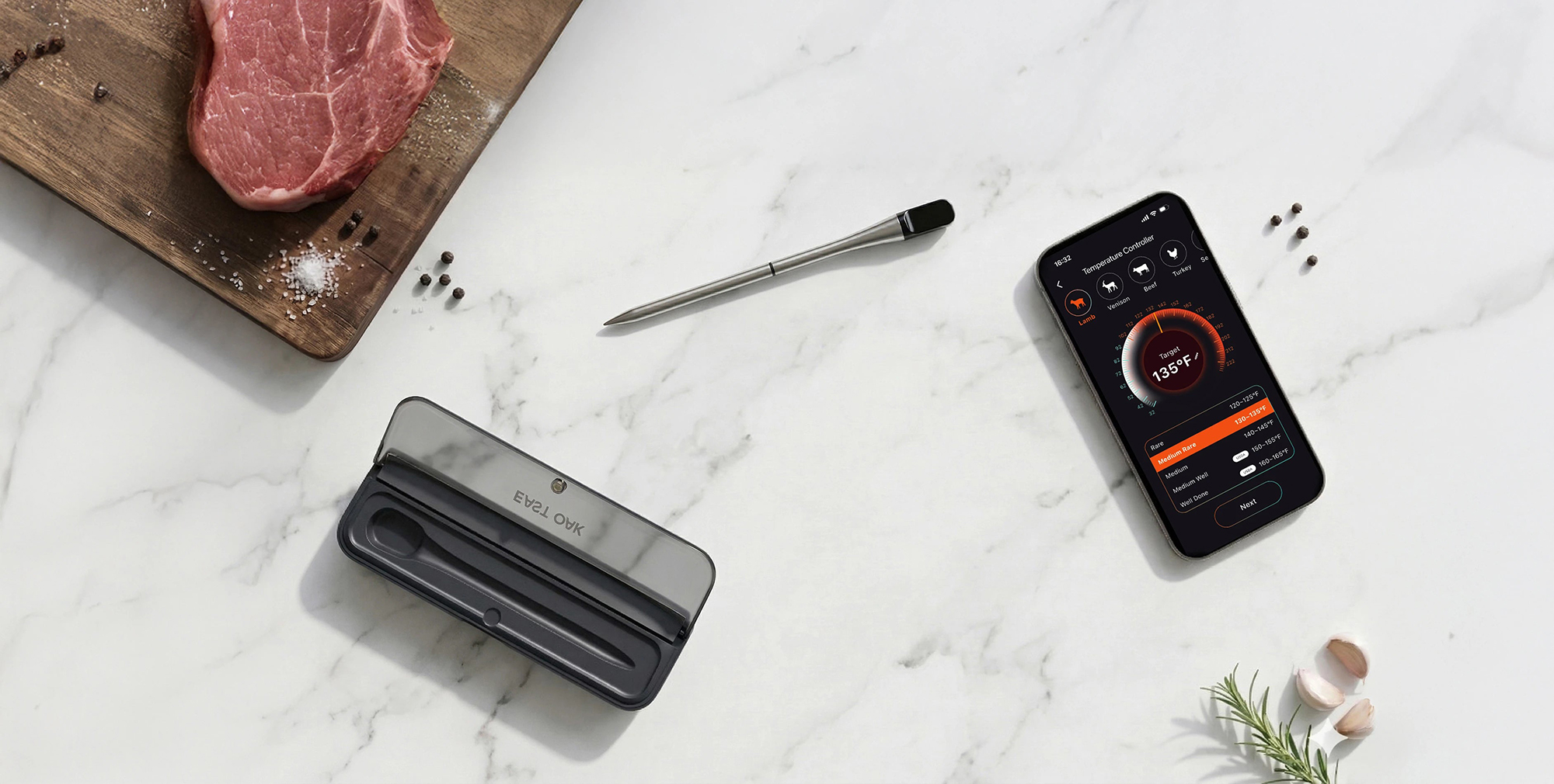A cell phone and a pen on a marble table