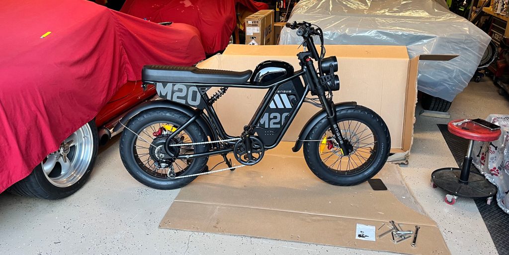 A black motorcycle on a cardboard box